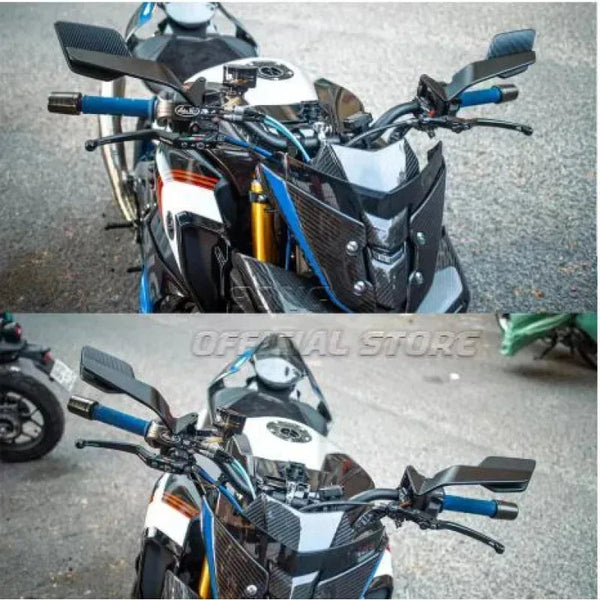 Vista cercana de espejos laterales negros y azules ajustables de motocicleta en una moto deportiva.