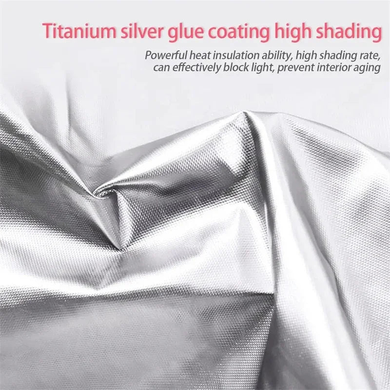 Close-up of a silver pleated sunshade fabric showing the texture and heat insulation coating.