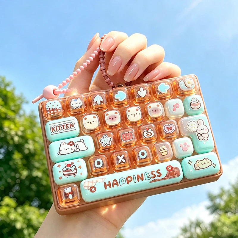A hand holds a colorful keycap stress relief button set featuring cute cartoon designs against a bright blue sky.