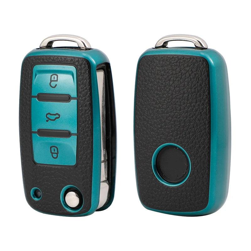 A pair of teal and black TPU leather car key cases with silver clasps.