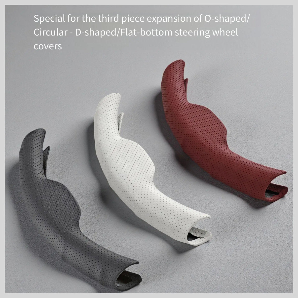 Three steering wheel covers in different shades of brown and white, showing the third piece expansion.