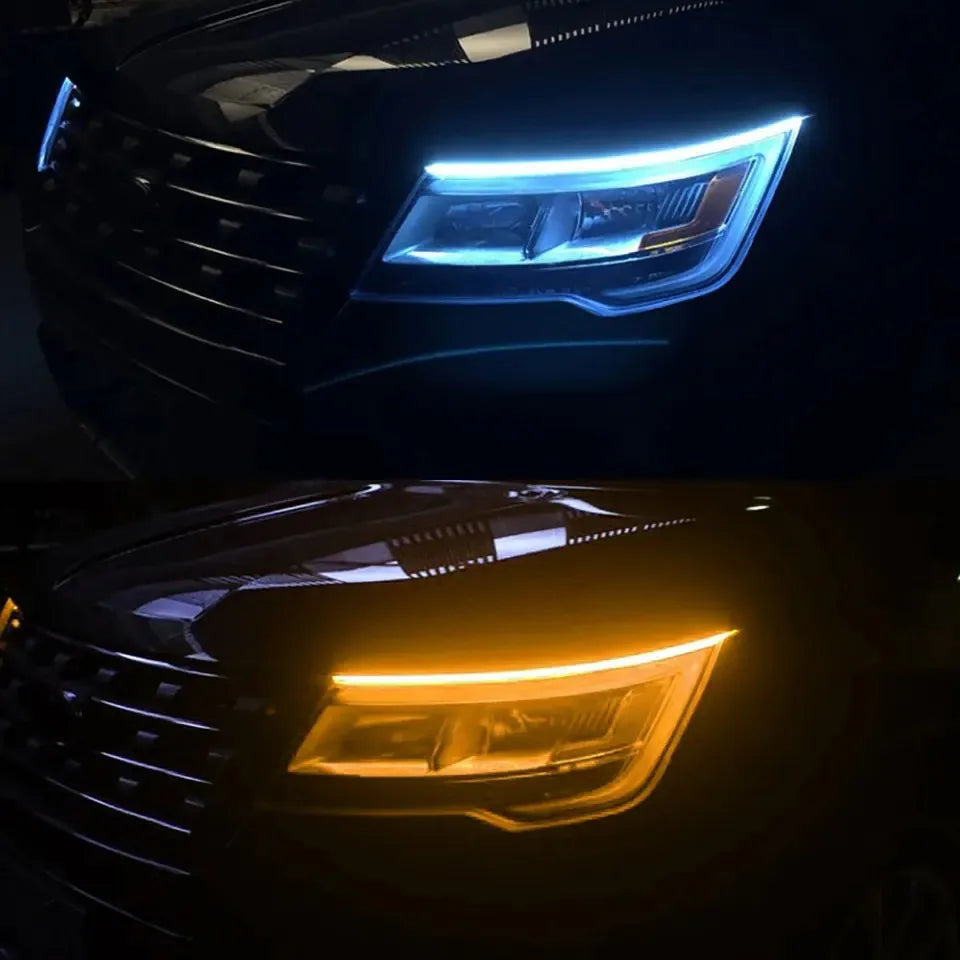Close-up view of an automotive headlight with bright blue LED daytime running lights.