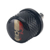 Black aftermarket motorcycle seat and fender bolts with a skull design.