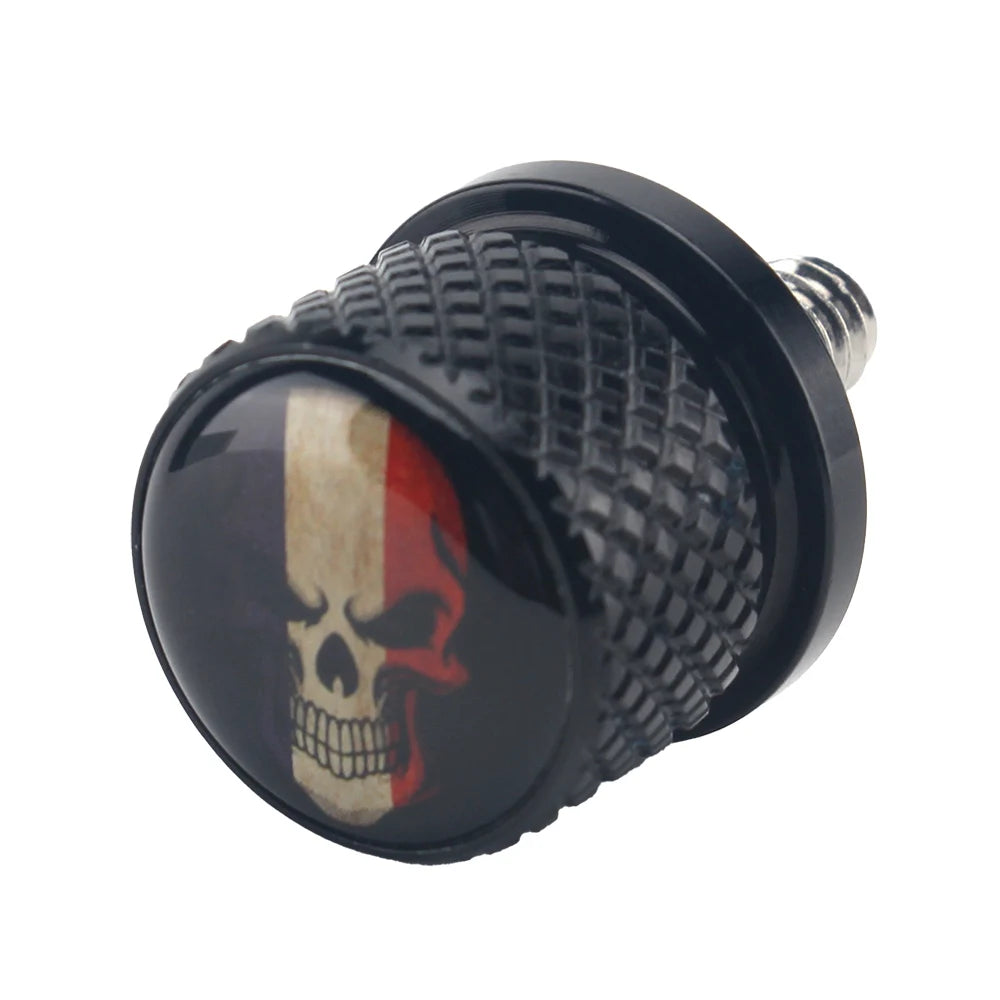 Black aftermarket motorcycle seat and fender bolts with a skull design.