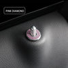 A close-up of a pink diamond car door lock pin trim set featuring a silver and pink gemstone design.