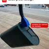 A dark green oil funnel tool with a blue nozzle is shown on a paved surface.