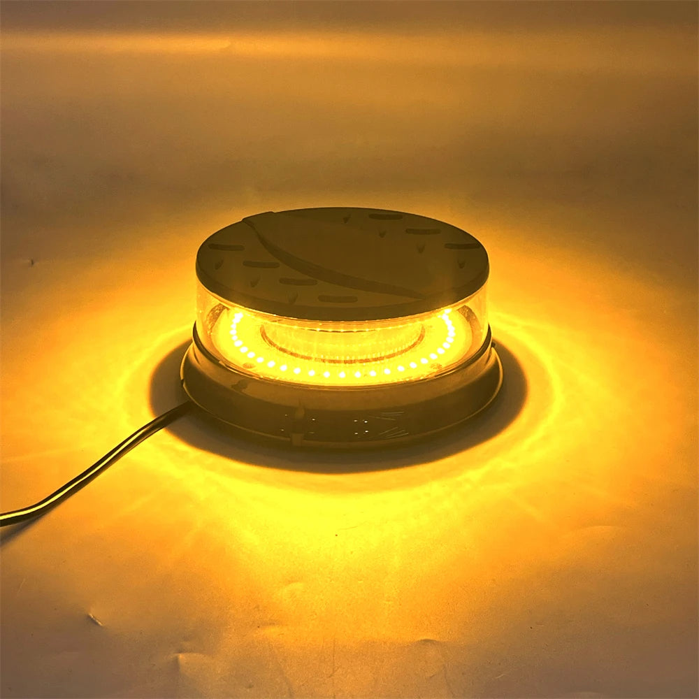 An emergency LED strobe light illuminates a bright yellow glow on a surface.