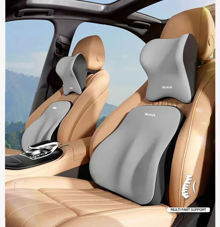 Ergonomic lumbar support pillows in gray and tan are shown installed in a car seat for travel.