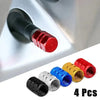 Four aluminum alloy tire valve caps in red, black, silver, and blue colors.