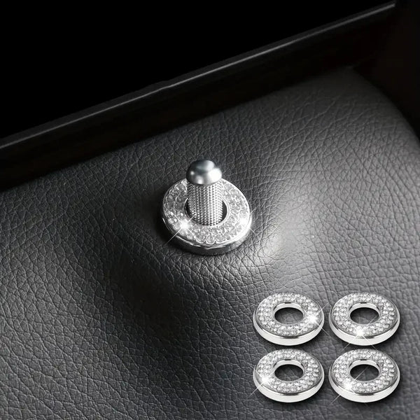 A set of elegant silver car door lock pin trim, featuring a polished metal pin and four circular rings.