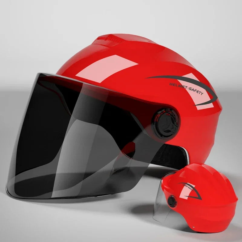 A red half helmet with a clear visor is shown on a gray background.