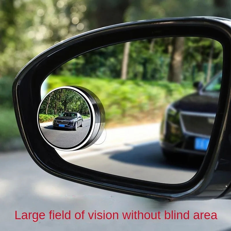 Close-up view of a black suction cup rearview mirror showing a wide field of vision.