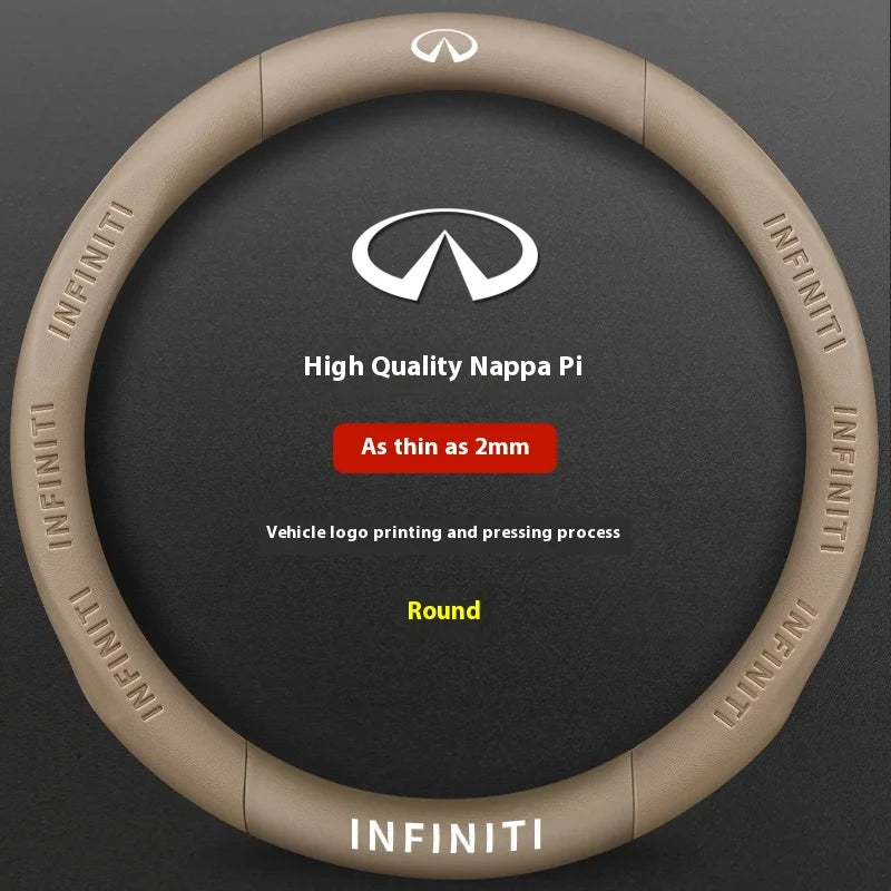 A round, tan steering wheel cover featuring the Infiniti logo and brand name printed on the surface.
