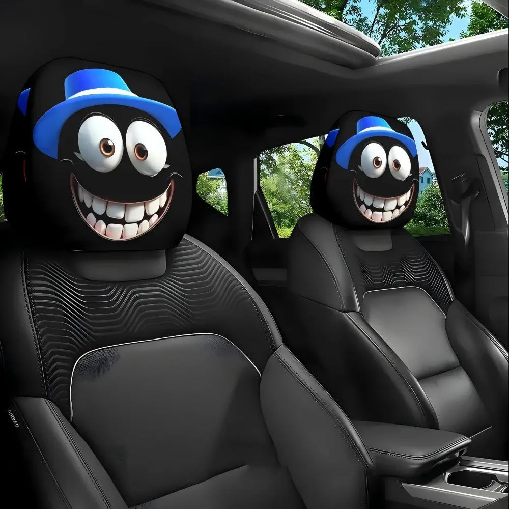 Two black car seat headrest covers with blue hats and decorative patterns shown inside a vehicle cabin.