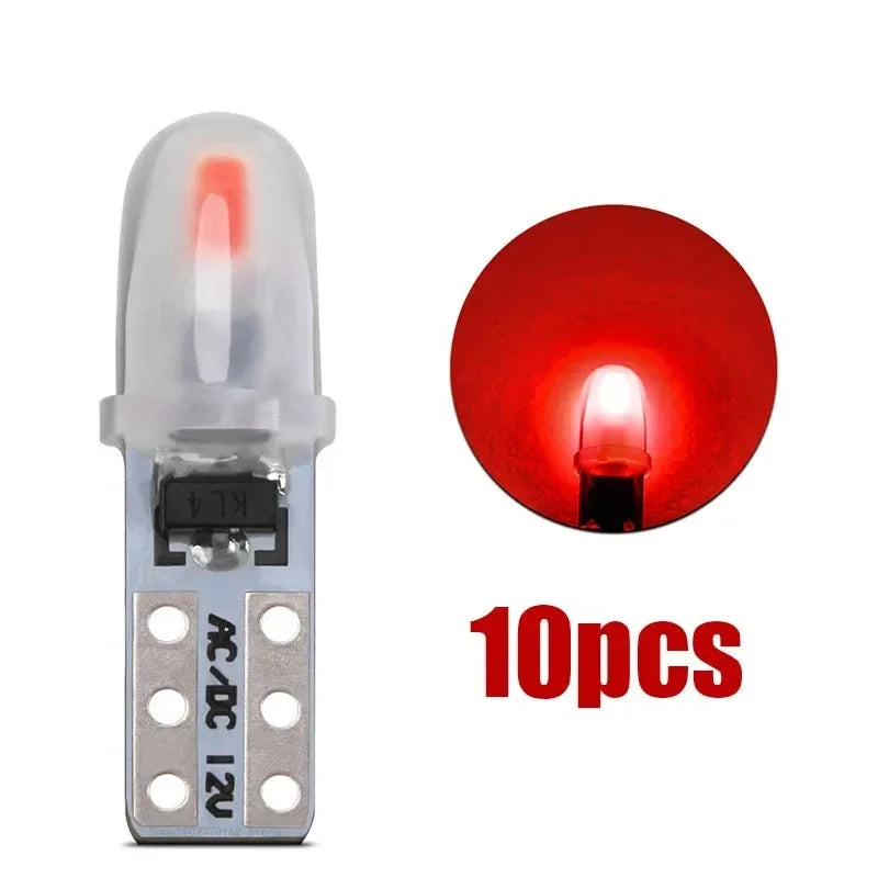 A set of 10 T5 LED dashboard and license plate bulbs, featuring clear glass bulbs with red illumination.