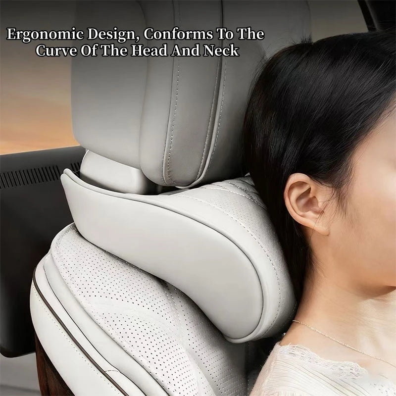 A close-up of a light gray ergonomic pillow conforming to the curve of a head and neck, shown in context with a person's head