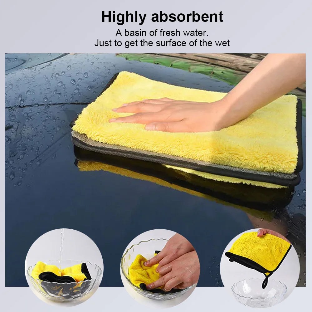 A yellow microfiber car washing towel soaking in a basin of fresh water.