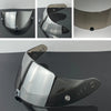 A motorcycle helmet visor lens shown in various angles and a full view, demonstrating its reflective surface.
