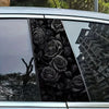 A close-up of a car window featuring a black rose decal design on the B-pillar.