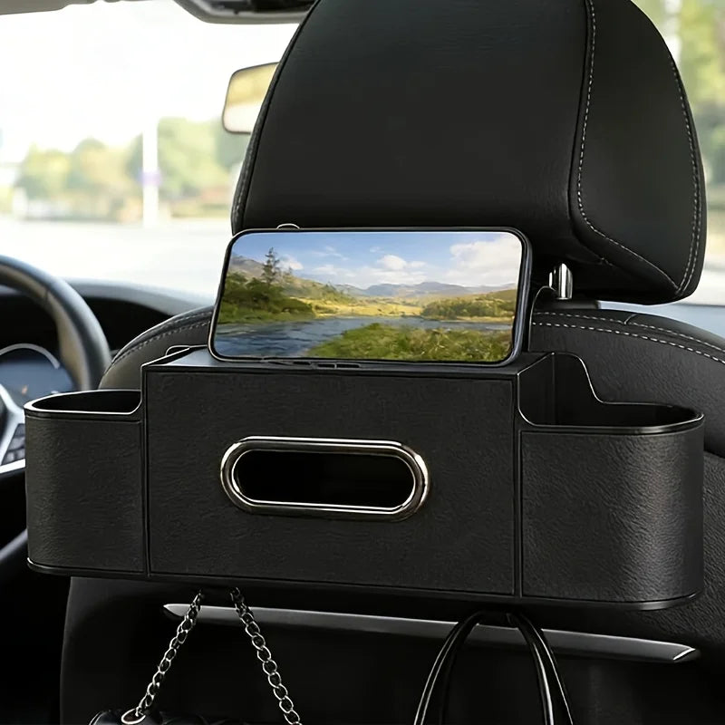 A black car seat back organizer storage box mounted on a vehicle seat, featuring a smartphone holder.