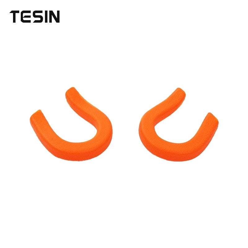 Two orange universal car exterior bumper tow hook covers.