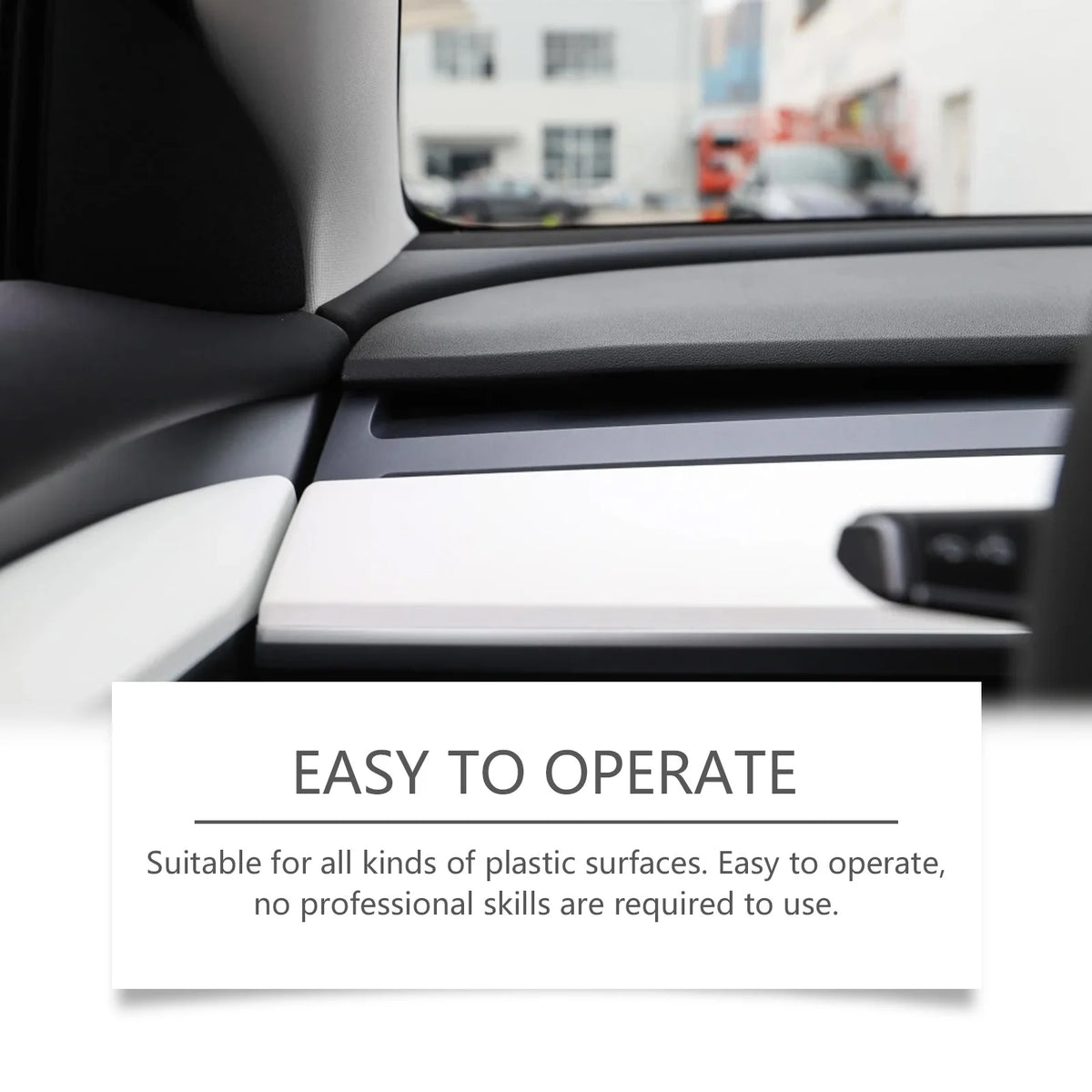A close-up of a car interior showing a plastic surface being treated with a restorer spray.
