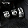 Silver sports pedal covers for a car interior, shown in a close-up view.