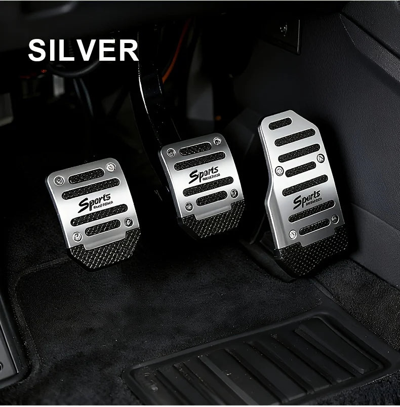 Silver sports pedal covers for a car interior, shown in a close-up view.
