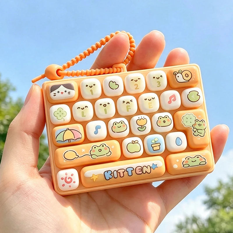An orange cartoon keycap stress relief button set is held in a hand against a bright blue sky.