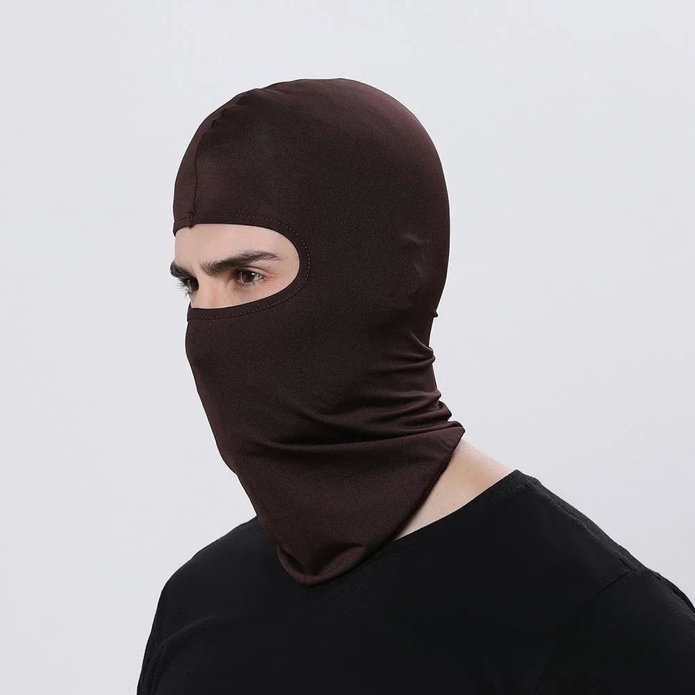 A person wearing a dark brown all-weather windproof balaclava face mask.