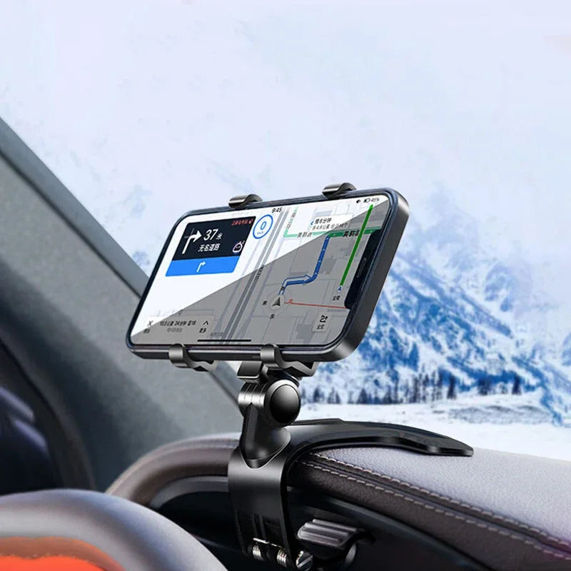 A phone mount is attached to a car dashboard, displaying a navigation map on a smartphone screen.