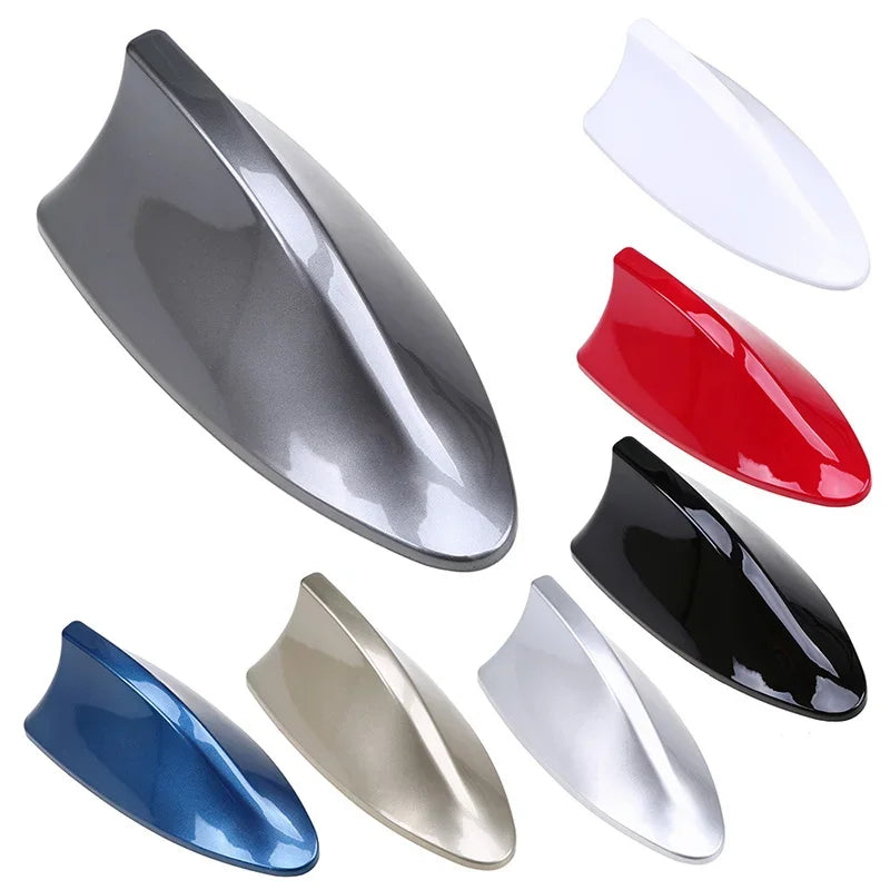 A collection of universal car shark fin antenna covers in various colors including gray, red, black, and blue.