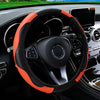 Orange and black PU carbon fiber steering wheel cover in a car interior