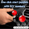A hand is shown inserting numbered red and black balls into a car start button joystick mechanism.