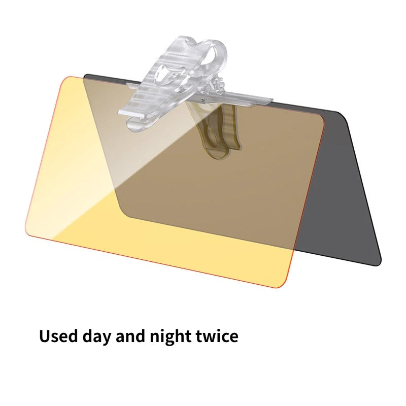 A clear polarized car sun visor with a dark tint and a plastic mounting clip is shown.