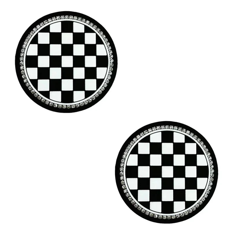 A set of two black and white checkered silicone car cup coasters.