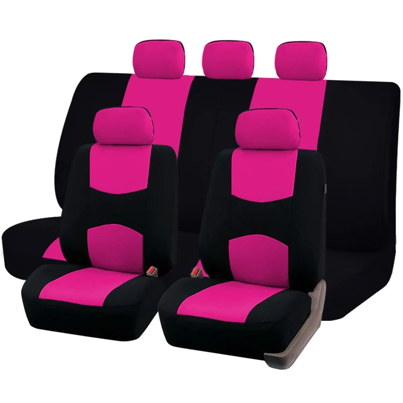 A set of black and magenta fabric car seat covers, including front and rear seats.