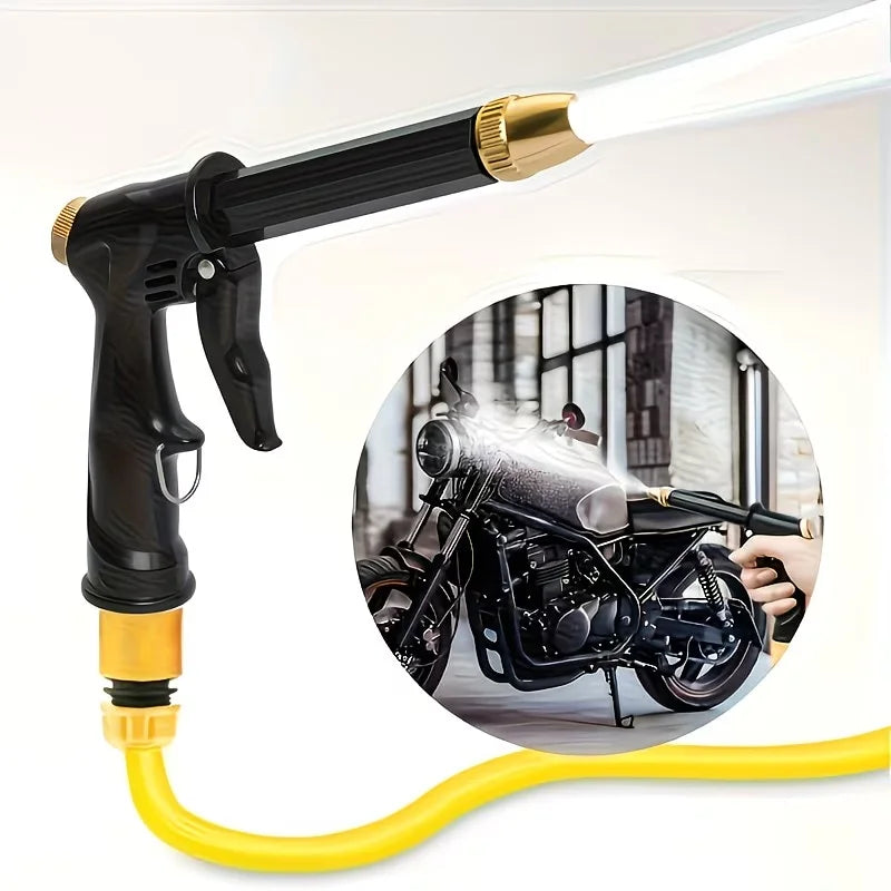 A black high-pressure cleaning gun with a yellow hose is shown next to a motorcycle.