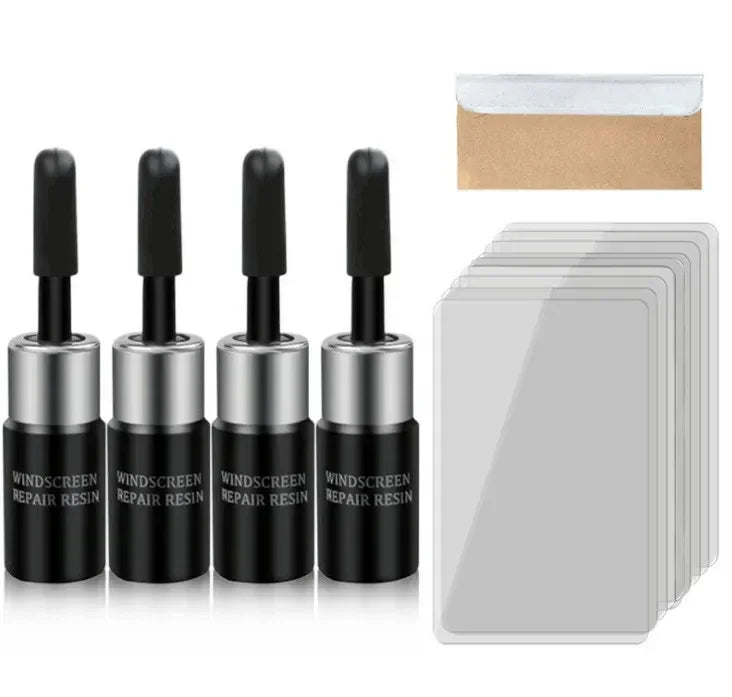 A set of black and silver windshield repair resin kits with a cardboard envelope.