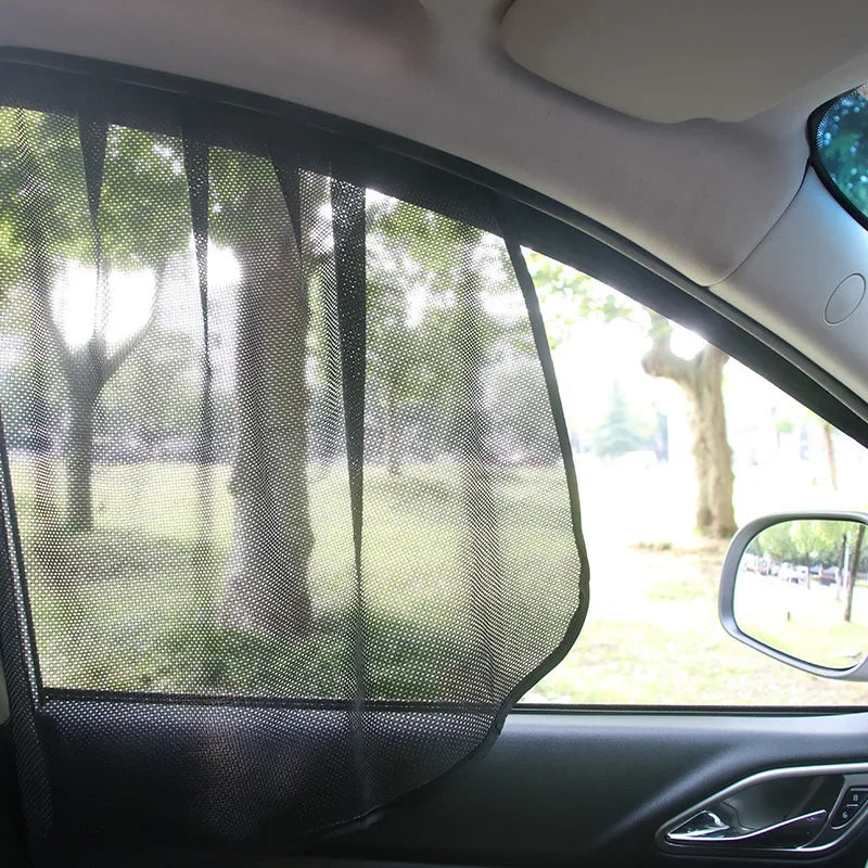 A magnetic car window sunshade is installed on a vehicle window, providing UV protection.