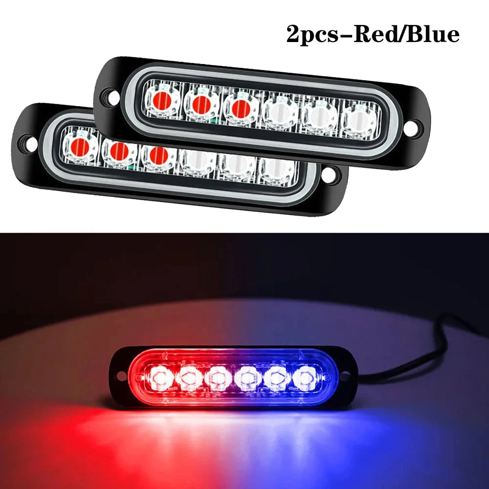 Deux feux clignotants rouges et bleus sur un boîtier noir, affichant une illumination rouge et bleue.