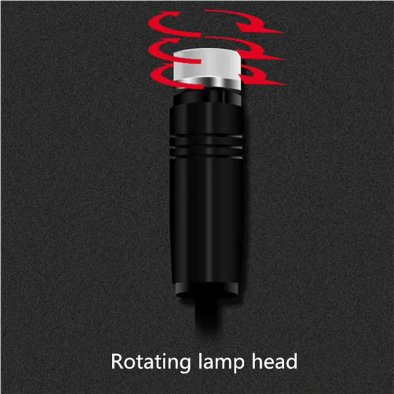 A black rotating lamp head with a silver light source and red wavy lines indicating movement.
