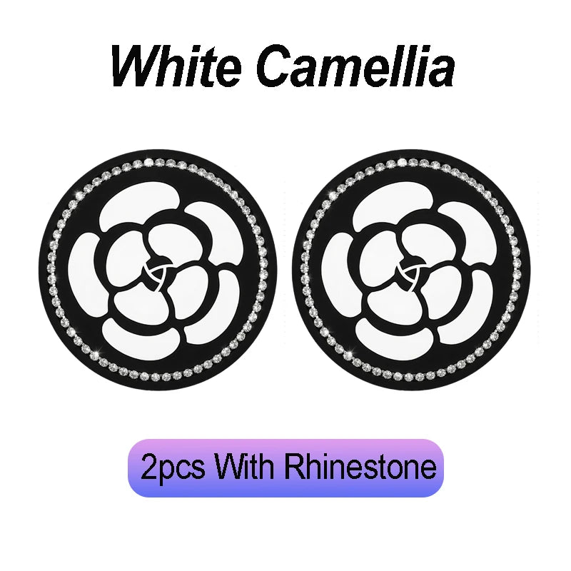Two black white camellia flower coasters with rhinestone borders