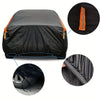 Black all-weather UV car protection cover shown folded and rolled with orange trim details