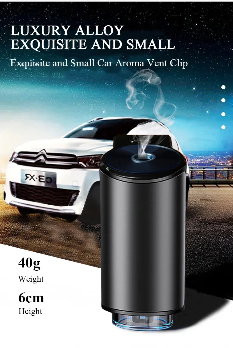 A black car aroma vent clip diffuser is shown next to a white car.