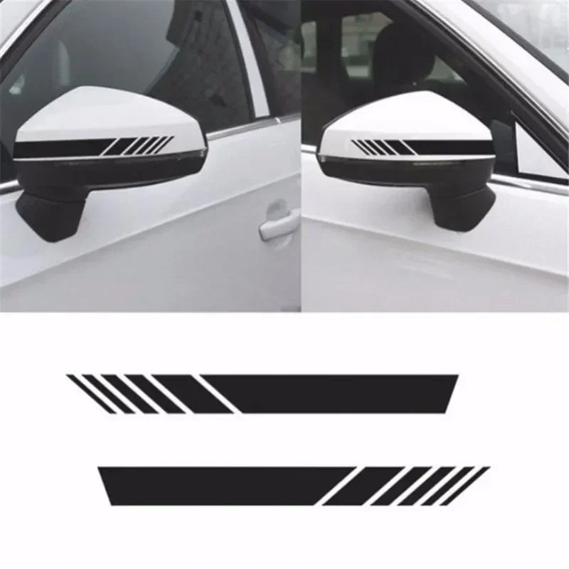 Close-up view of a white car side mirror with a black racing stripe decal applied to the housing.