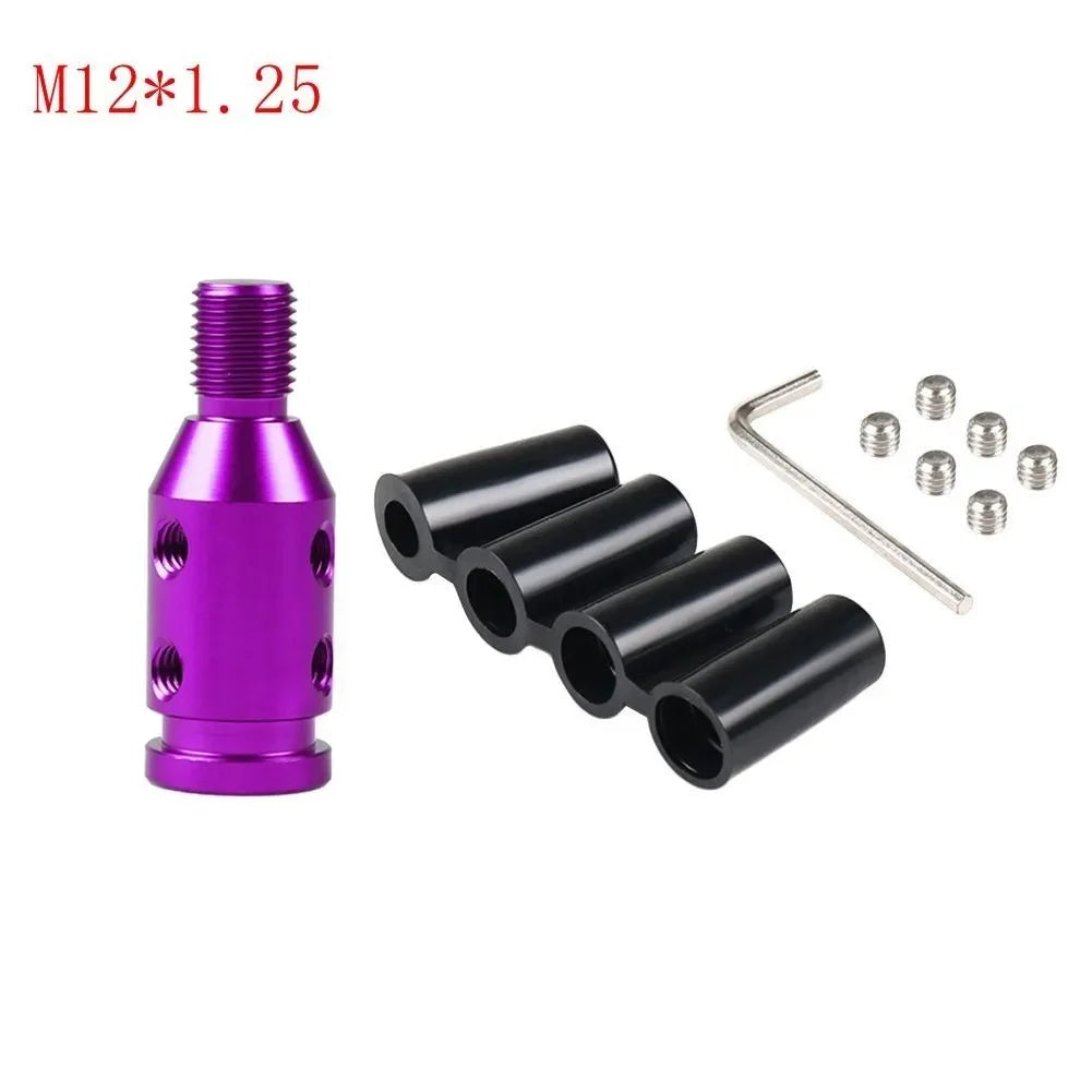 A purple M12*1.25 threaded adapter and several black cylindrical components for a gear shift knob.