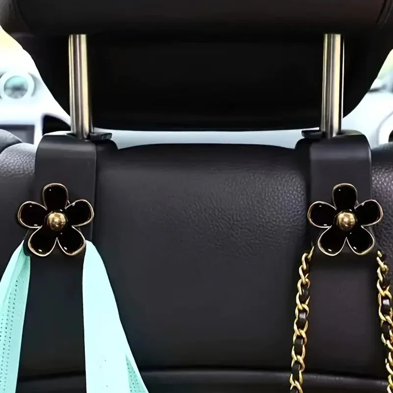 Support pour tête de siège de voiture noir avec accents dorés et sangle en tissu bleu clair pour l'organisation