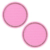 A set of pink decorative rhinestone car coasters with a hexagonal pattern.
