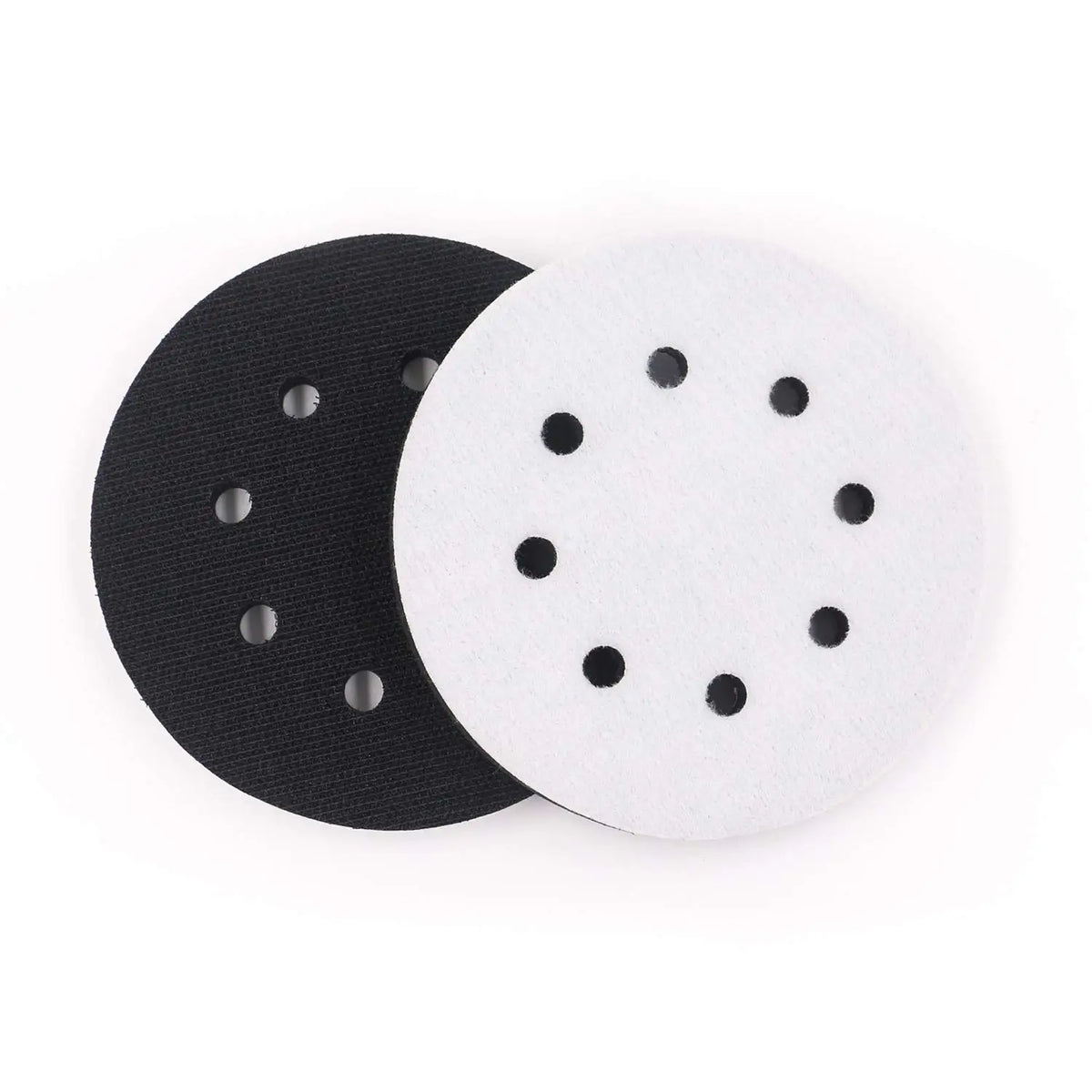 Two abrasive interface pads, one black and one white, for sanding and polishing.